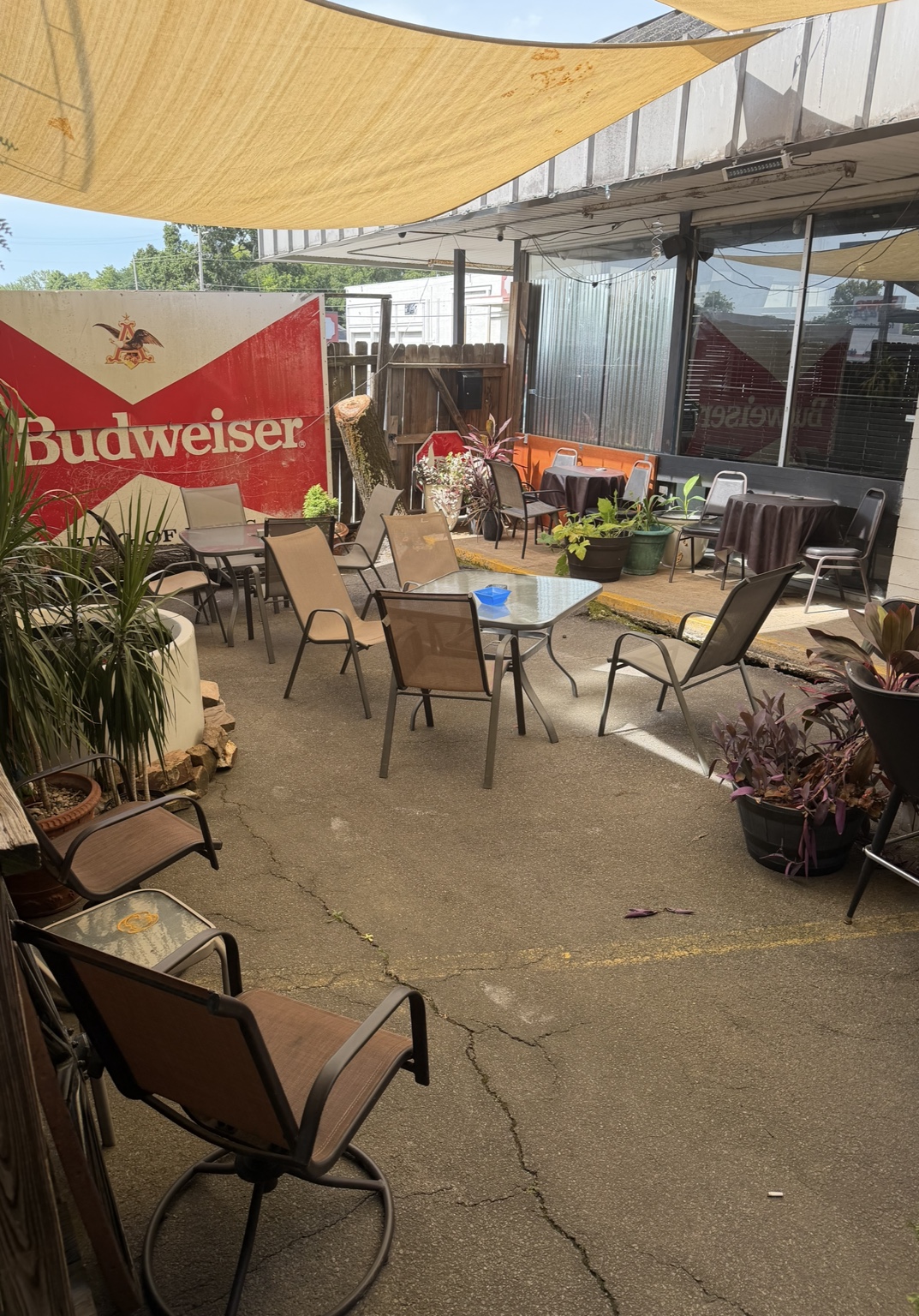 Open-air CHAPS patio courtyard with shaded tables and plants